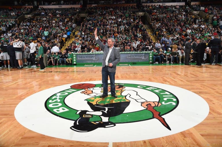 Rusty Sullivan standing at center court of the TD Garden waving to fans